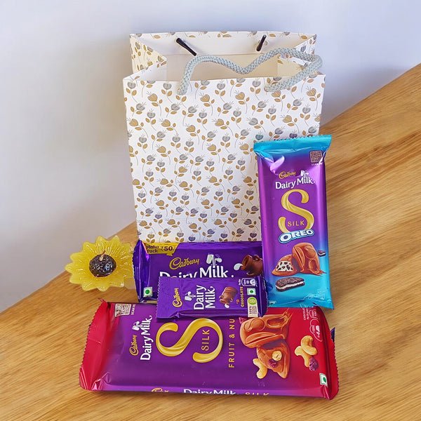 Cadbury Chocolates Delights with Candle - Flowers to Nepal - FTN