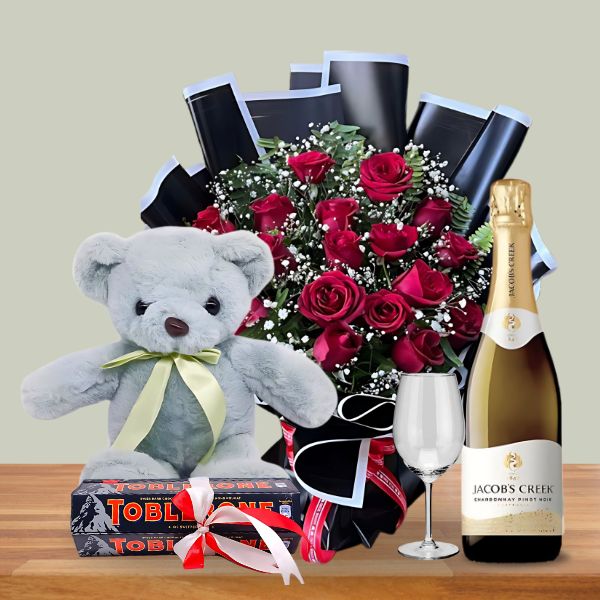 Luxurious Delight Combo ( Rose Bouquet, Teddy Bear, Wine and Toblerone ) - Flowers to Nepal - FTN