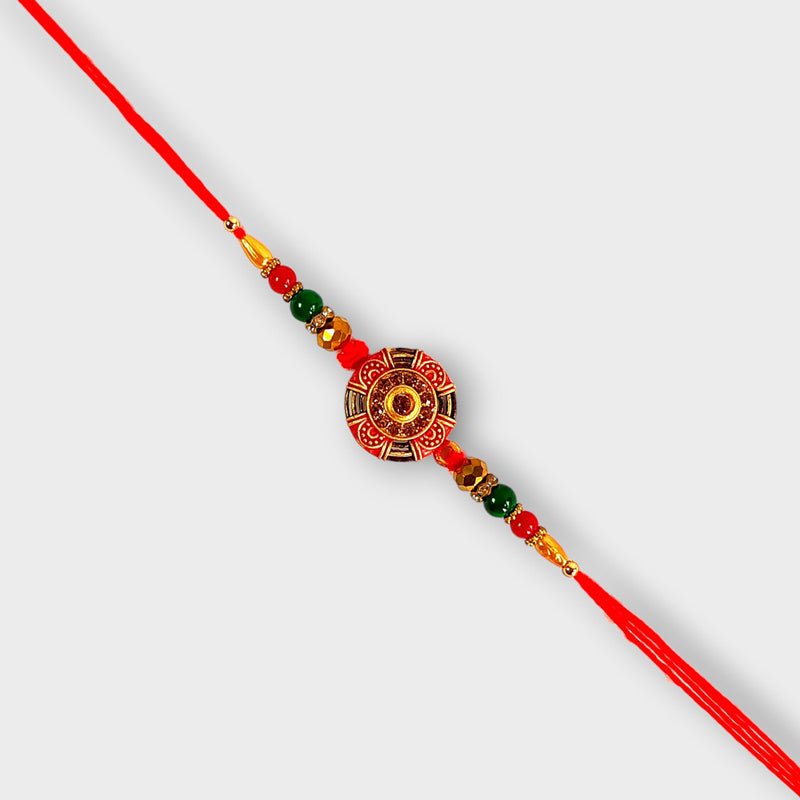 Round Golden and Red Rakhi for Brother - Flowers to Nepal - FTN