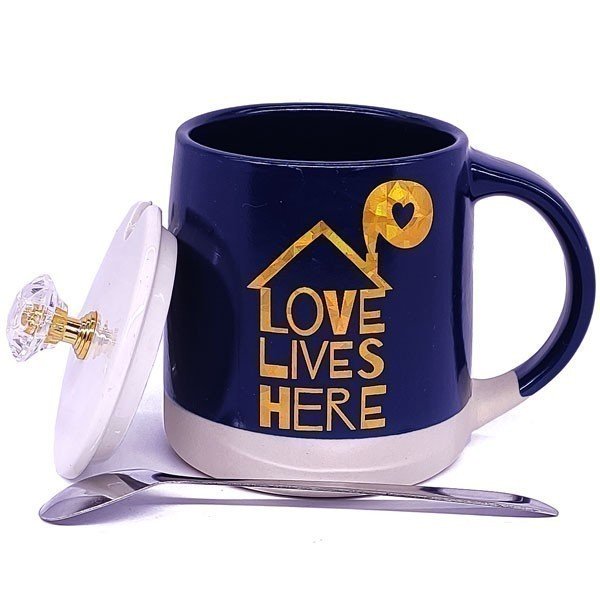 
                  
                    Ceramic Coffee Mug Set with Lid, Steel Spoon, and 'Love Lives Here' Print - Flowers to Nepal - FTN
                  
                